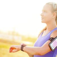 Woman using fitness tracker smartwatch
