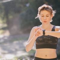 Woman using smartwatch during workout