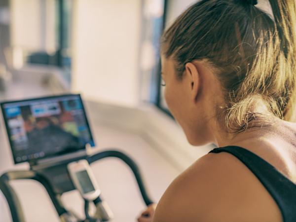 Woman sweating on stationary bike