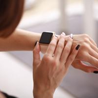 Woman using Apple Watch