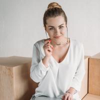 Businesswoman working on laptop at standing desk